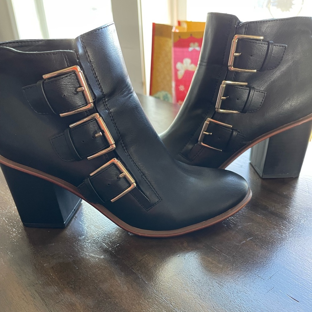Restricted black ankle booties